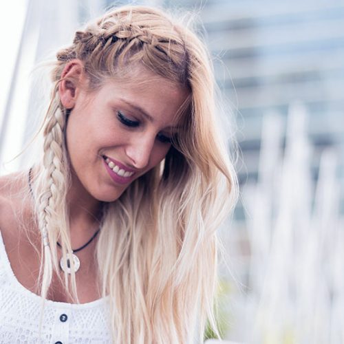 happy-beautiful-blonde-woman-smiling-looking-at-4GABJRD.jpg